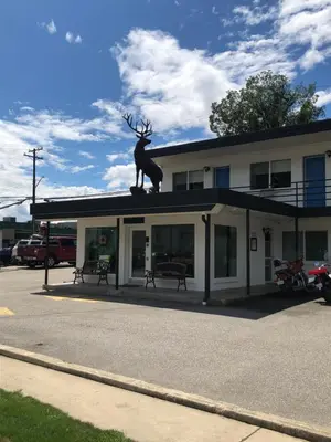 a statue of a deer on the roof of a building at Revelstoke Lodge in Revelstoke