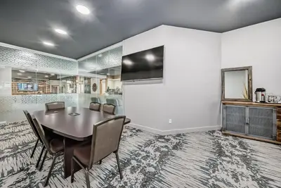a dining room with a table and chairs at Invermere Inn & Suites in Invermere