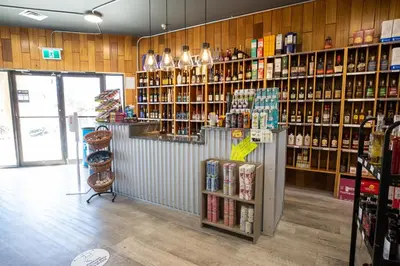 a store with a lot of bottles of alcohol at Invermere Inn & Suites in Invermere