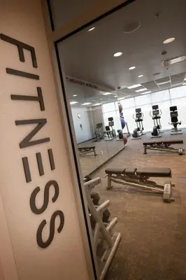 a gym with a wall with the word mezzo at Fairfield by Marriott Edmonton International Airport in Edmonton
