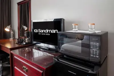 a microwave oven sitting on top of a table at Sandman Inn Cache Creek in Cache Creek