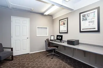 an office with a desk with a computer on it at Sandman Inn Kamloops in Kamloops