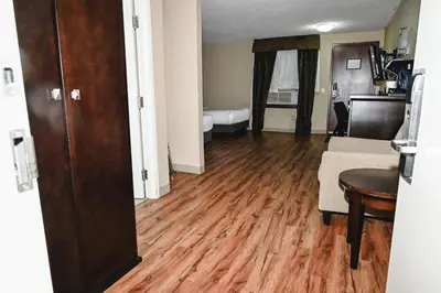 a living room with a couch and a table at Quality Hotel & Conference Centre in Peace River