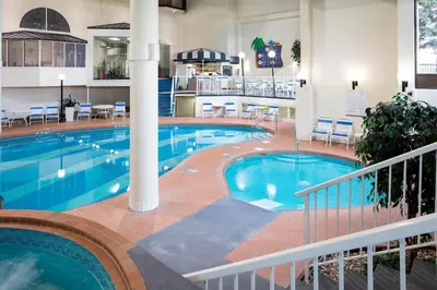 a large swimming pool in a hotel room at Sheraton Cavalier Calgary Hotel in Calgary