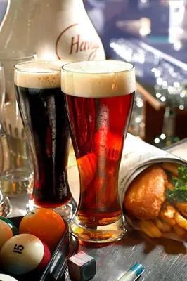 two glasses of beer sitting on a table at Sheraton Cavalier Calgary Hotel in Calgary
