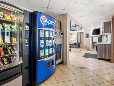 a pepsi machine in a store at Super 8 by Wyndham Meadow Lake in Meadow Lake