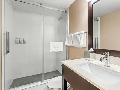a bathroom with a sink and a shower at Super 8 by Wyndham Meadow Lake in Meadow Lake