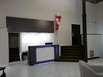 a room with a large screen in the middle of a building at Wells Gray Inn in Clearwater