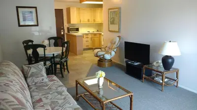 a living room with a couch and a table at Wessex Inn By The Sea in Cowichan Bay