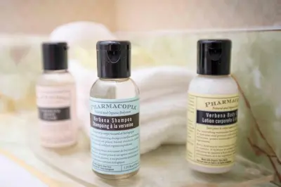 three bottles of moisturizers are sitting on a shelf at Sandman Inn McBride in McBride