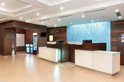 a lobby of a hotel with a large aquarium at Fairfield Inn & Suites by Marriott Vernon in Vernon