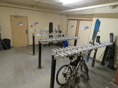 a room with a bike parked in a room at Fireside Lodge #413 By Bear Country in Sun Peaks