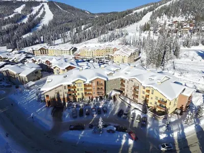 an aerial view of a resort in the snow at Fireside Lodge #315 By Bear Country in Sun Peaks