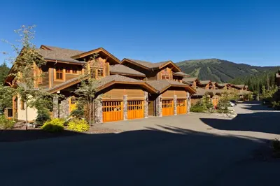 a large log home with a large driveway at Woodhaven #36 By Bear Country in Sun Peaks