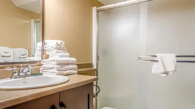a bathroom with a sink and a shower at Stones Throw #11 By Bear Country in Sun Peaks