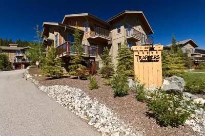 a large house with a sign in front of it at Trappers Landing #06 By Bear Country in Sun Peaks
