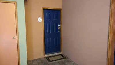 a blue door in the corner of a room at Crystal Forest #60 By Bear Country in Sun Peaks
