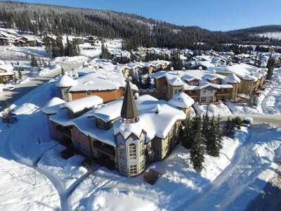 an aerial view of a town covered in snow at Crystal Forest #53 By Bear Country in Sun Peaks