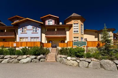 a large house with a sign in front of it at Crystal Forest #07 By Bear Country in Sun Peaks