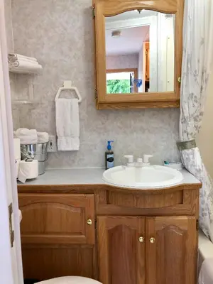 a bathroom with a sink and a mirror at Garden Bay Hideaway - Glamping & RV in Garden Bay