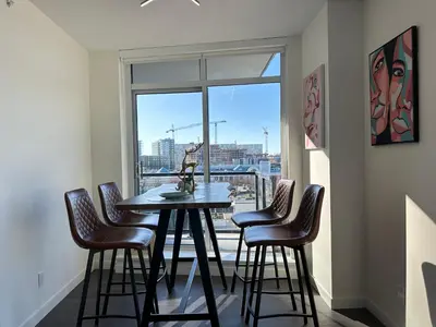 a table and chairs in a room with a window at Gorgeous Place In Downtown RMD in Richmond