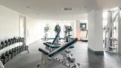 a gym with treadmills and machines in a room at Gorgeous Place In Downtown RMD in Richmond