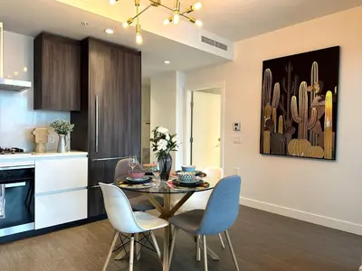 a kitchen and dining room with a table and chairs at Gorgeous Place In Downtown RMD in Richmond