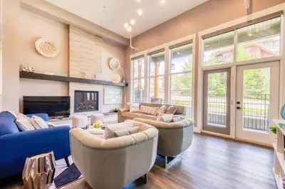a living room with couches and a fireplace at Nomad by Samsara Resort - Panorama Top View - 4BR & 5BTH in Canmore