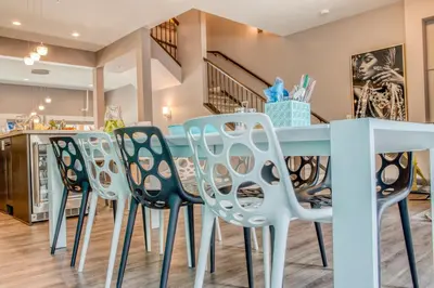 a dining room with a table and chairs at Nomad by Samsara Resort - Panorama Top View - 4BR & 5BTH in Canmore