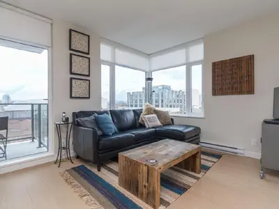 a living room with a couch and a coffee table at City Centre in Victoria