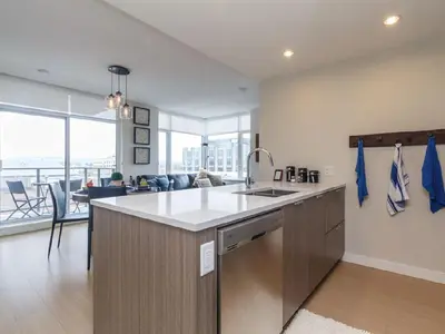 a kitchen with a sink and a counter top at City Centre in Victoria