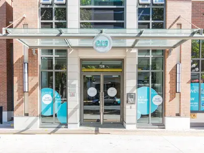 a store front with two revolving doors in a building at City Centre in Victoria