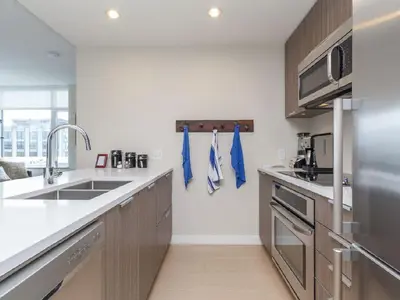 a kitchen with a sink and a counter top at City Centre in Victoria