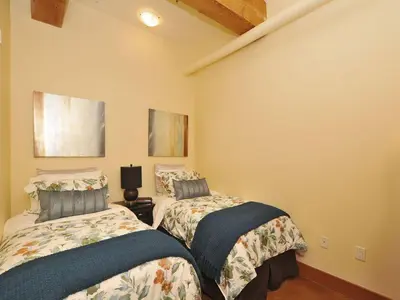 a bedroom with two beds in a room at Gorgeous Luxury 2 Bedroom 2 Bath Condo In Old Town Victoria in Victoria
