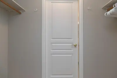 a white door in a room at Deluxe 2 Bed 2 Bath And 5 Min Walk To Downtown And Seawalk in Victoria