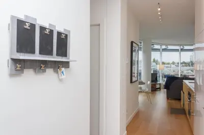 a hallway with a kitchen and a living room at Enjoy The Waterway Action At Your Doorstep in Victoria