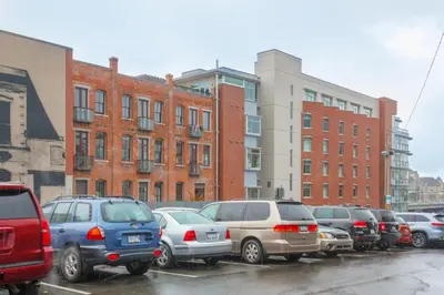 a bunch of cars parked in a parking lot at Enjoy The Waterway Action At Your Doorstep in Victoria