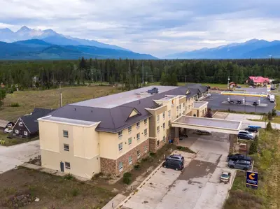 an aerial view of a building with a parking lot at Comfort Inn & Suites in Valemount