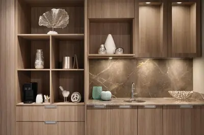 a kitchen with wooden cabinets and a sink at Seaside Hotel North Vancouver in North Vancouver