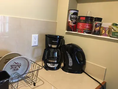 a coffee maker on a counter in a kitchen at 民宿Ann's House in Calgary in Calgary