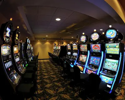 a row of slot machines in a casino at Camrose Resort Hotel in Camrose