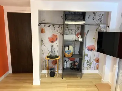 a room with a wall with flowers painted on it at \u597d\u4e18\u3002Hacho House in Yellowknife