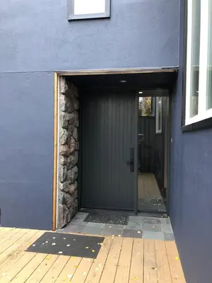 a door to a building with a wooden floor at \u597d\u4e18\u3002Hacho House in Yellowknife