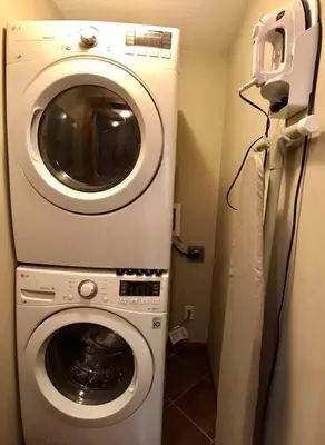 a washer and dryer in a small room at Luxurious & Spacious Mountain Retreat in Canmore