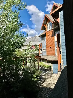 a view of a house with a mountain in the background at Luxurious & Spacious Mountain Retreat in Canmore