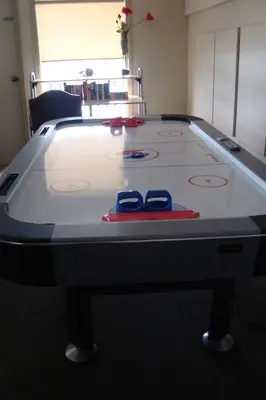 a ping pong table with two pairs of scissors on it at YPC Fitness & Accomodations in Invermere