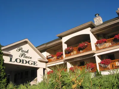 a building with a sign that reads rent mage lodge at Park Place Lodge in Fernie