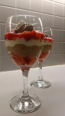 two wine glasses with dessert in them on a counter at Hidden Valley Bed and Breakfast in Whitehorse