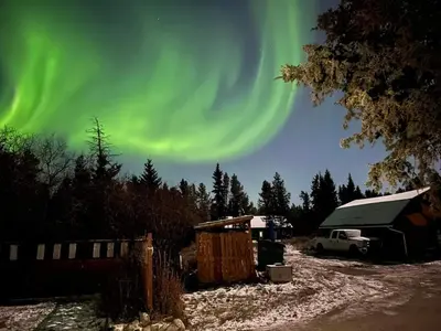 an image of the aurora in the sky over a camper at Hidden Valley Bed and Breakfast in Whitehorse