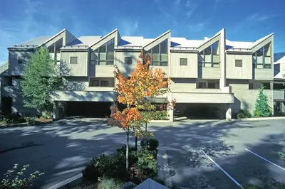 a large house with a tree in front of it at Worldmark Whistler Sundance in Whistler